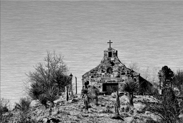 A black and white photo of an old church